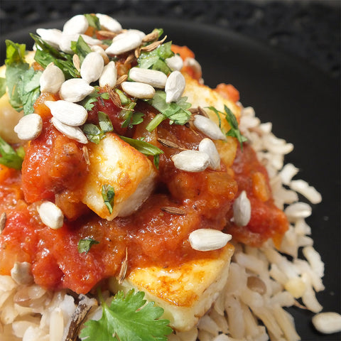 Fried Paneer with Red Cape Curry Sauce on brown rice and lentils