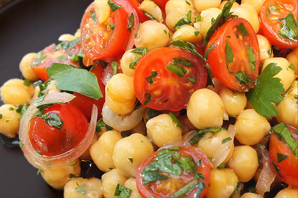 Chickpeas, cherry tomatoes and red onion, marinated in dressing with Peri Peri Ghost.