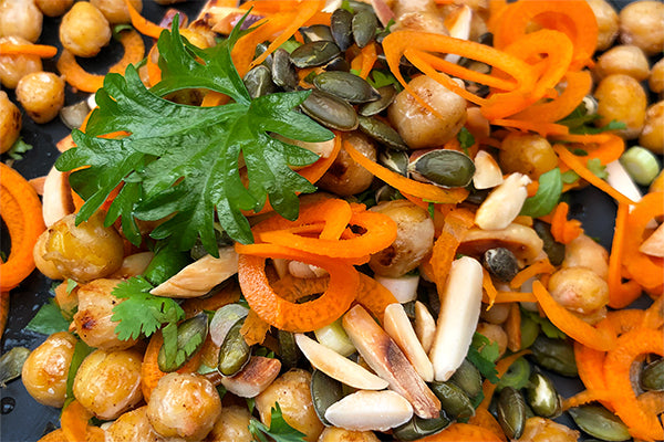 Ukuva Gold sauce is makes an excellent dressing for fried chickpeas and slivered almonds with carrot spirals.