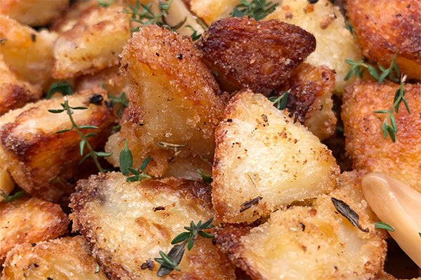 Duck fat roast potatoes with a crust of semolina flavoured with Lamb Seasoning