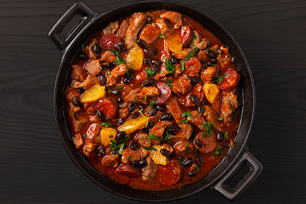 Chicken, pork and Chorizo in a red pepper and tomato sauce with black beans and oranges, flavored with Smoked Seasoning.