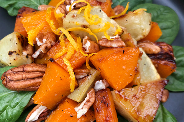 Sweet Ginger Relish mixed into fresh lemon juice makes a delicious dressing for roast sweet potato and butternut with pecan nuts on new spinach leaves.