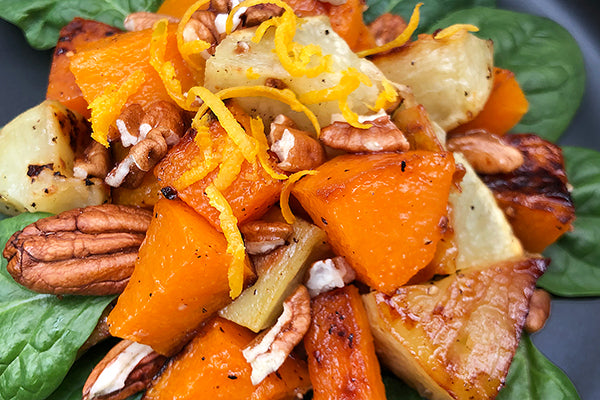 Roast Sweet potato and butternut dressed with Ukuva Ginger& Chilli Hot Drops, served on new spinach leaves with pecans and lemon zest.