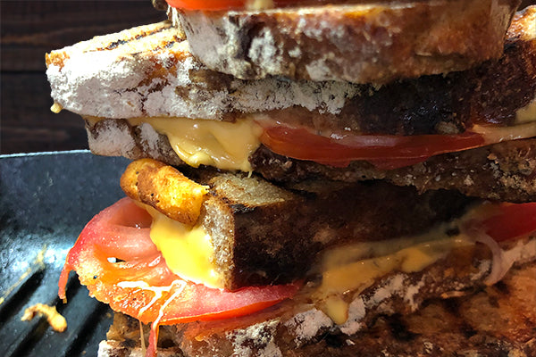 Oh the joy of Sourdough toasties with cheese, tomato and onion, with a generous splash of Ukuva Garlic Chilli Hot Drops in the super sturcture!
