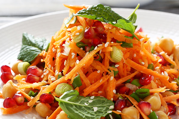 Carrot salad with chickpeas, mint, sesame and pomegranate jewels