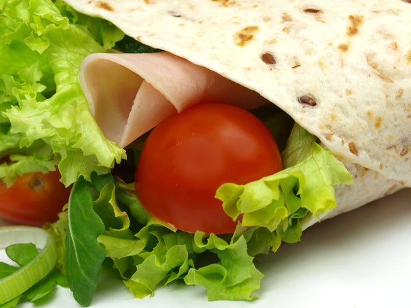 Wholegrain wrap with ham, lettuce and fresh tomato (the cheese is inside!) is perfectly boosted with Pepperdrop Mustard.