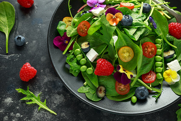Salad of fresh greens, spring vegetables and berries - perfectly seasoned with Lemon Salt
